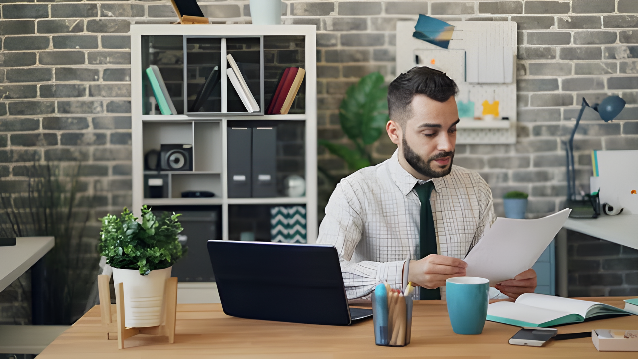 Person opening IRS collection notice with worried expression