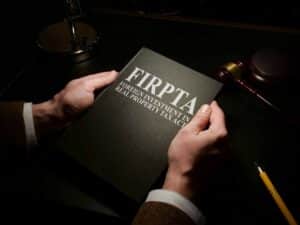 FIRPTA man holding book